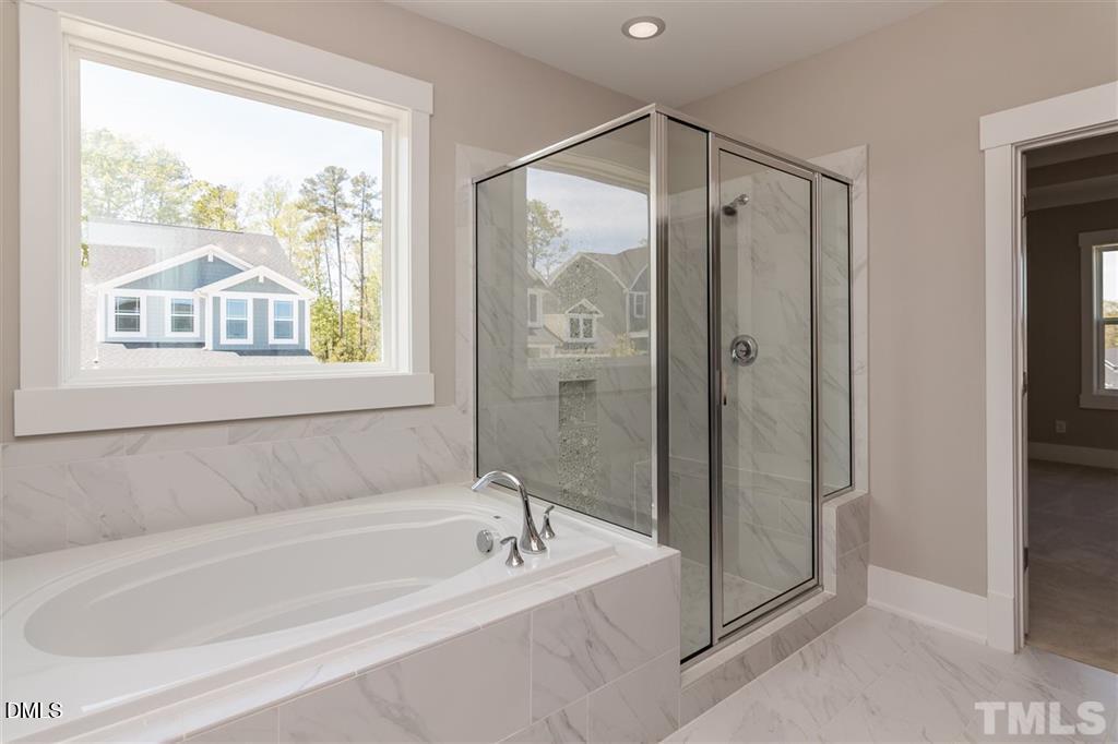 14 Tarwick Avenue Chapel Hill, NC 27516 - Photo 21 of 47 a spacious bathroom with a bathtub and a shower