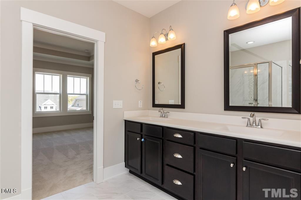 14 Tarwick Avenue Chapel Hill, NC 27516 - Photo 22 of 47 a bathroom with a double vanity sink and mirror