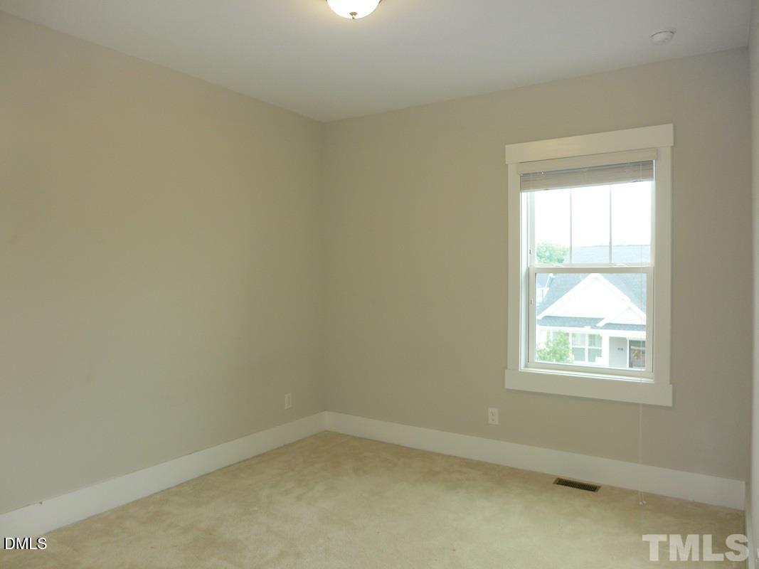 14 Tarwick Avenue Chapel Hill, NC 27516 - Photo 26 of 47 an empty room with a window