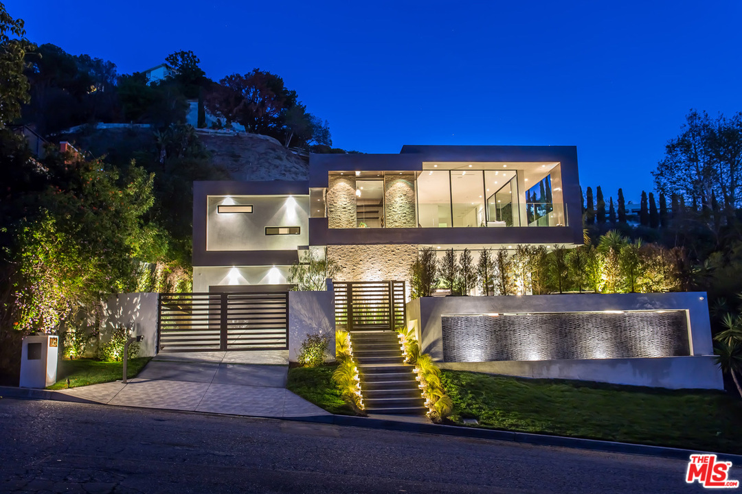 1424 Rising Glen Road Los Angeles, CA 90069 - Photo 1 of 48 a front view of a house with a yard
