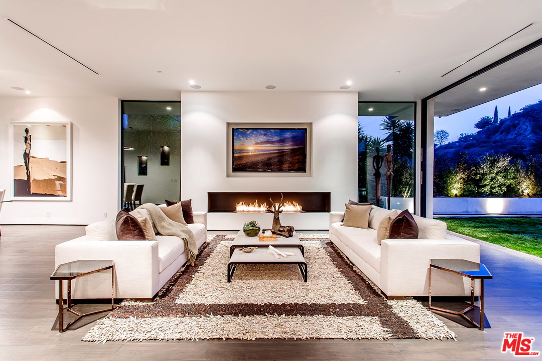 1424 Rising Glen Road Los Angeles, CA 90069 - Photo 2 of 48 a living room with furniture and a fireplace