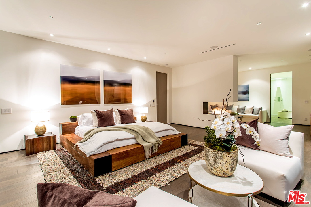 1424 Rising Glen Road Los Angeles, CA 90069 - Photo 15 of 48 a bed room with furniture and a large window