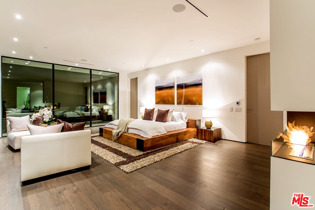 1424 Rising Glen Road Los Angeles, CA 90069 - Photo 16 of 48 a living room with furniture and a flat screen tv