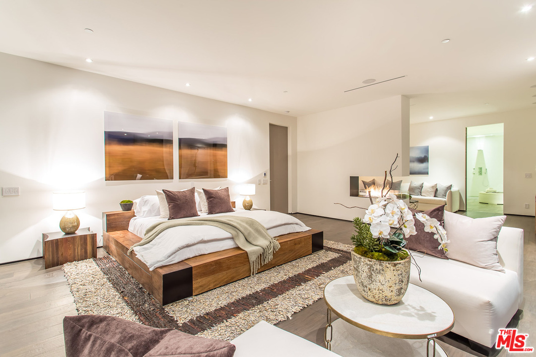 1424 Rising Glen Road Los Angeles, CA 90069 - Photo 17 of 48 a living room with furniture potted plant and a large window