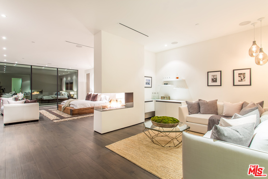 1424 Rising Glen Road Los Angeles, CA 90069 - Photo 18 of 48 a living room with furniture and a large window