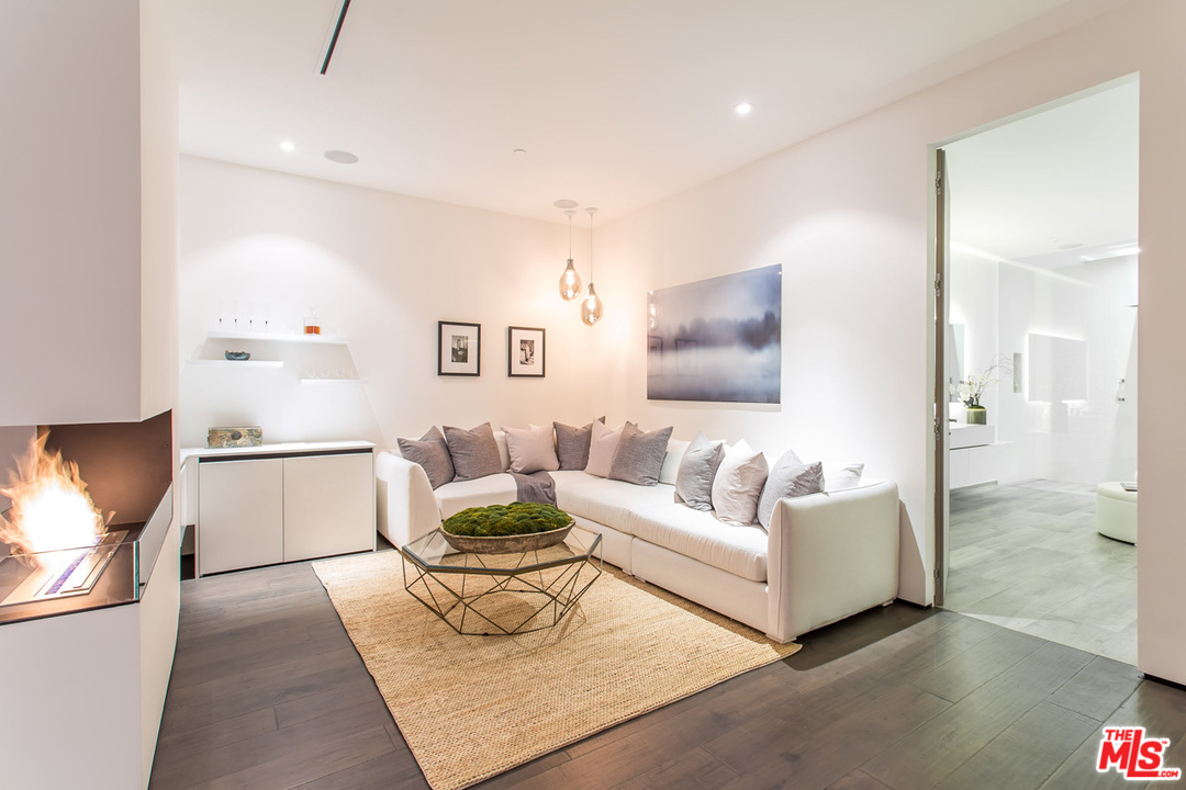 1424 Rising Glen Road Los Angeles, CA 90069 - Photo 19 of 48 a living room with furniture and a couch