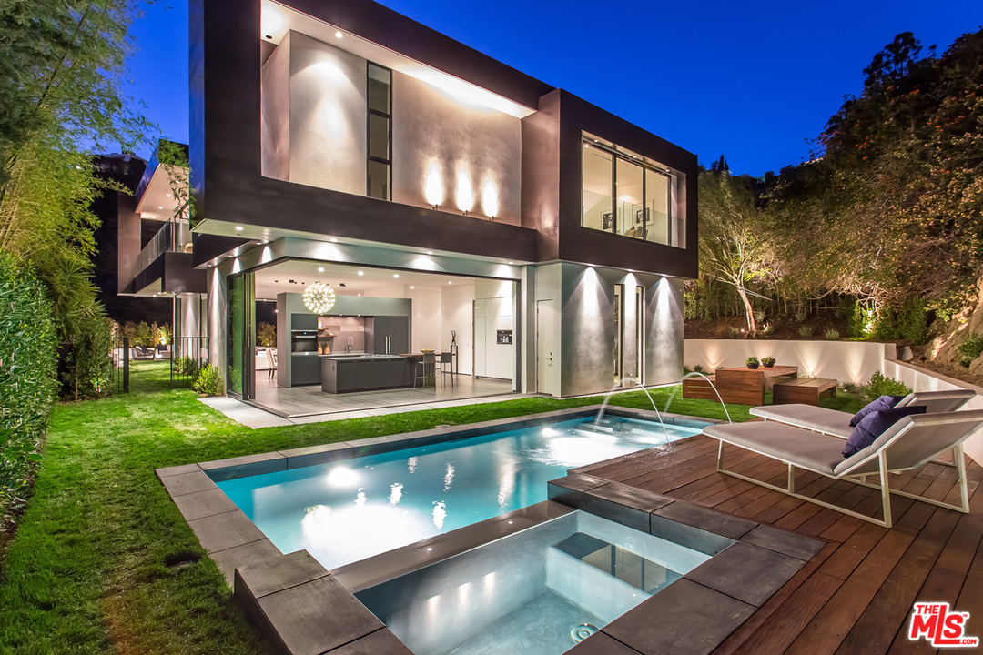 1424 Rising Glen Road Los Angeles, CA 90069 - Photo 3 of 48 a view of a house with swimming pool and sitting area