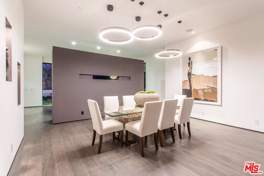 1424 Rising Glen Road Los Angeles, CA 90069 - Photo 27 of 48 a dining room with furniture and wooden floor