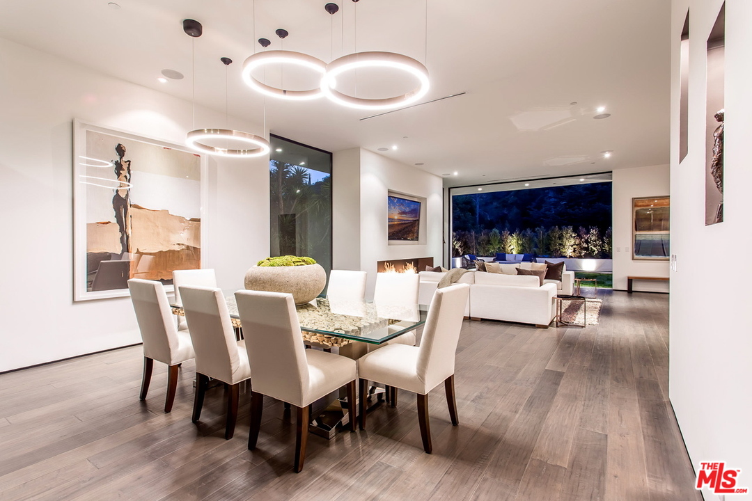 1424 Rising Glen Road Los Angeles, CA 90069 - Photo 28 of 48 a view of a dining room with furniture and wooden floor