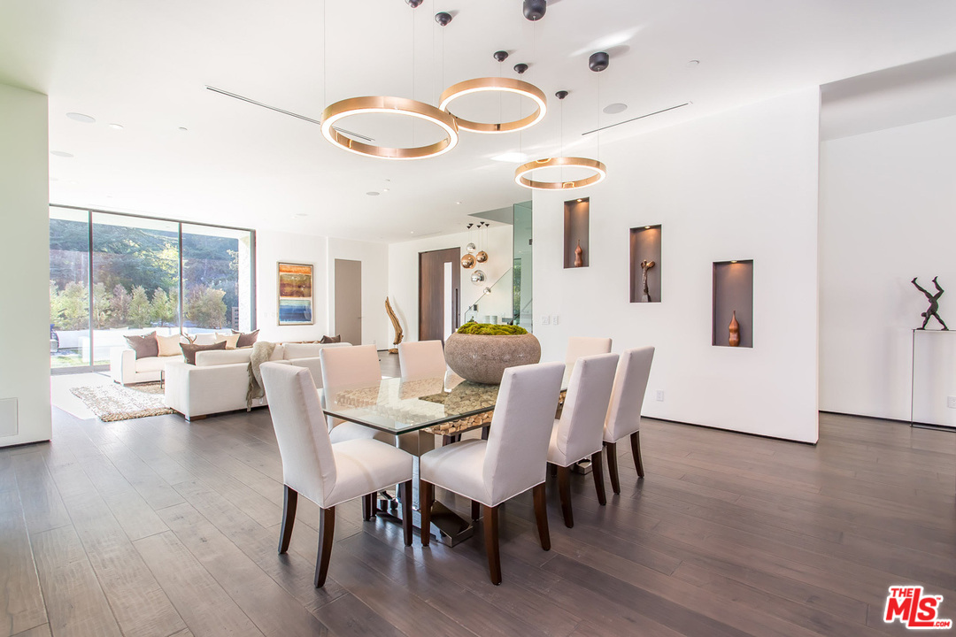 1424 Rising Glen Road Los Angeles, CA 90069 - Photo 29 of 48 a view of a dining room with furniture and wooden floor