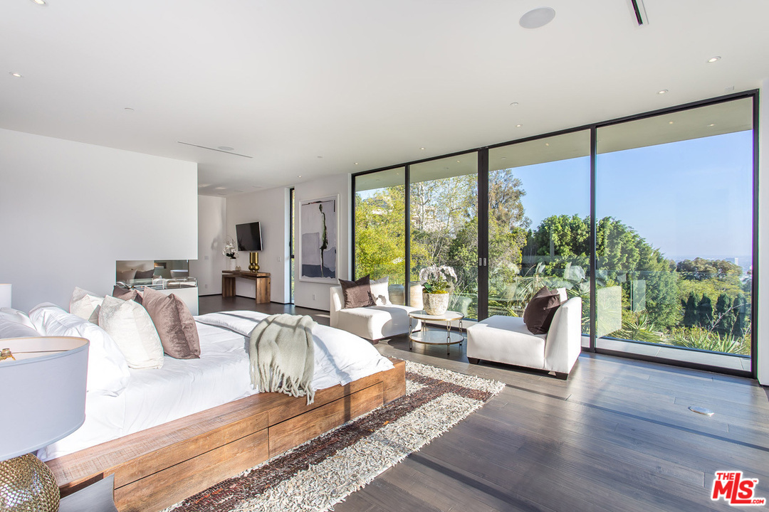 1424 Rising Glen Road Los Angeles, CA 90069 - Photo 35 of 48 a living room with furniture and a large window