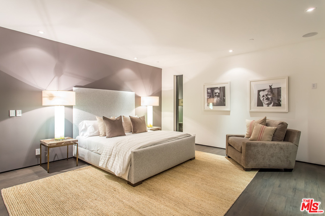 1424 Rising Glen Road Los Angeles, CA 90069 - Photo 42 of 48 a bedroom with a bed and a couch
