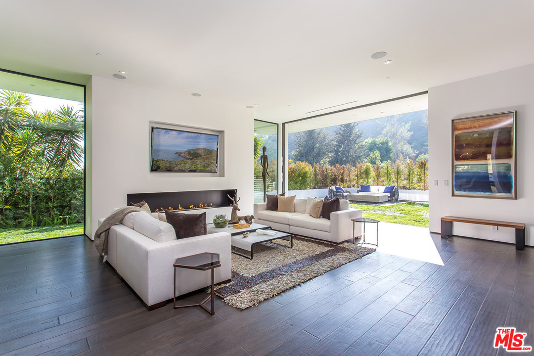 1424 Rising Glen Road Los Angeles, CA 90069 - Photo 8 of 48 a living room with furniture and a large window