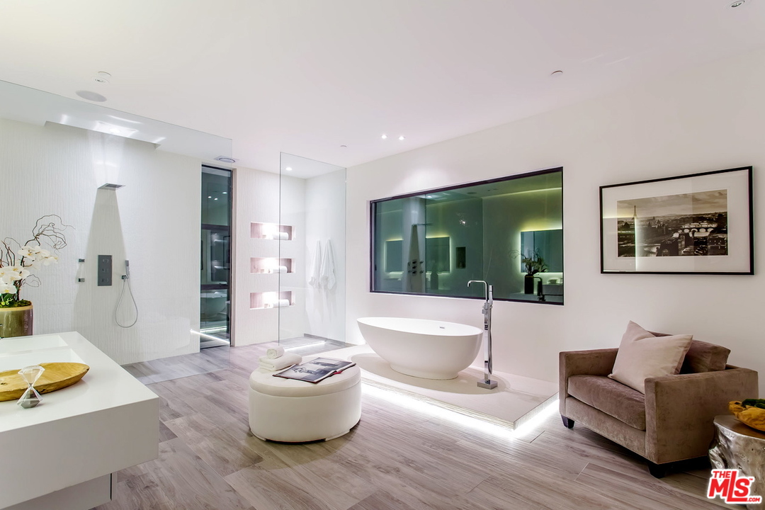 1424 Rising Glen Road Los Angeles, CA 90069 - Photo 10 of 48 a living room with furniture and a large window
