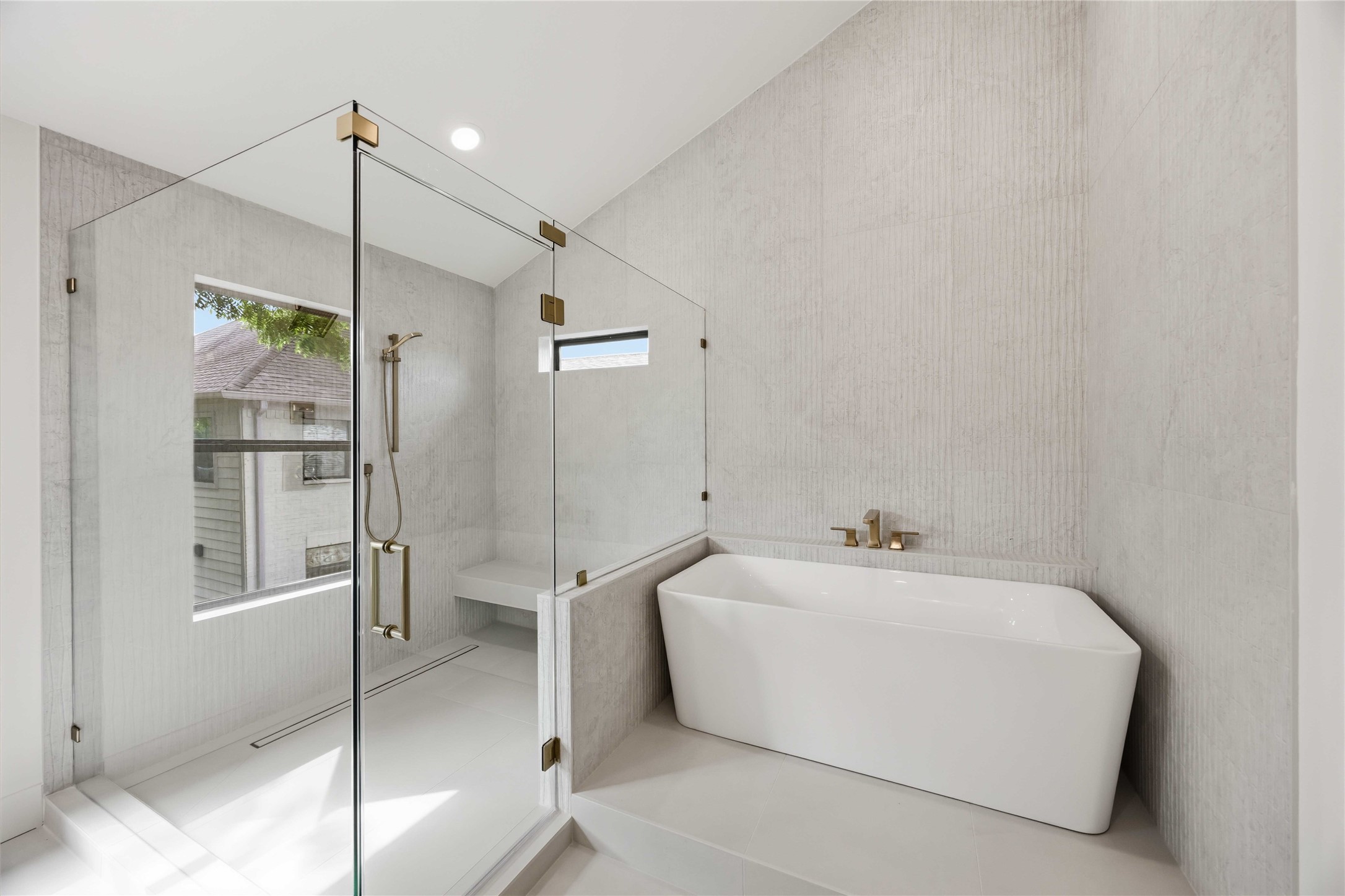 3214 Prospect Street Houston, TX 77004 - Photo 11 of 35 Primary Bathroom - The window is a reflection off of the shower glass. It is NOT actually in the shower.