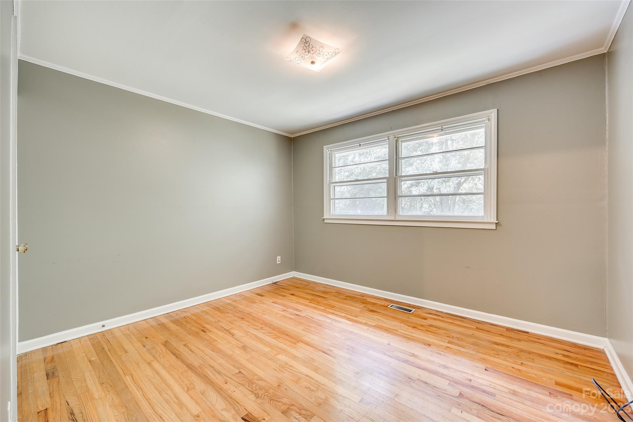 1136 East Woodlawn Road Charlotte, NC 28209 - Photo 11 of 27 a view of empty room with wooden floor