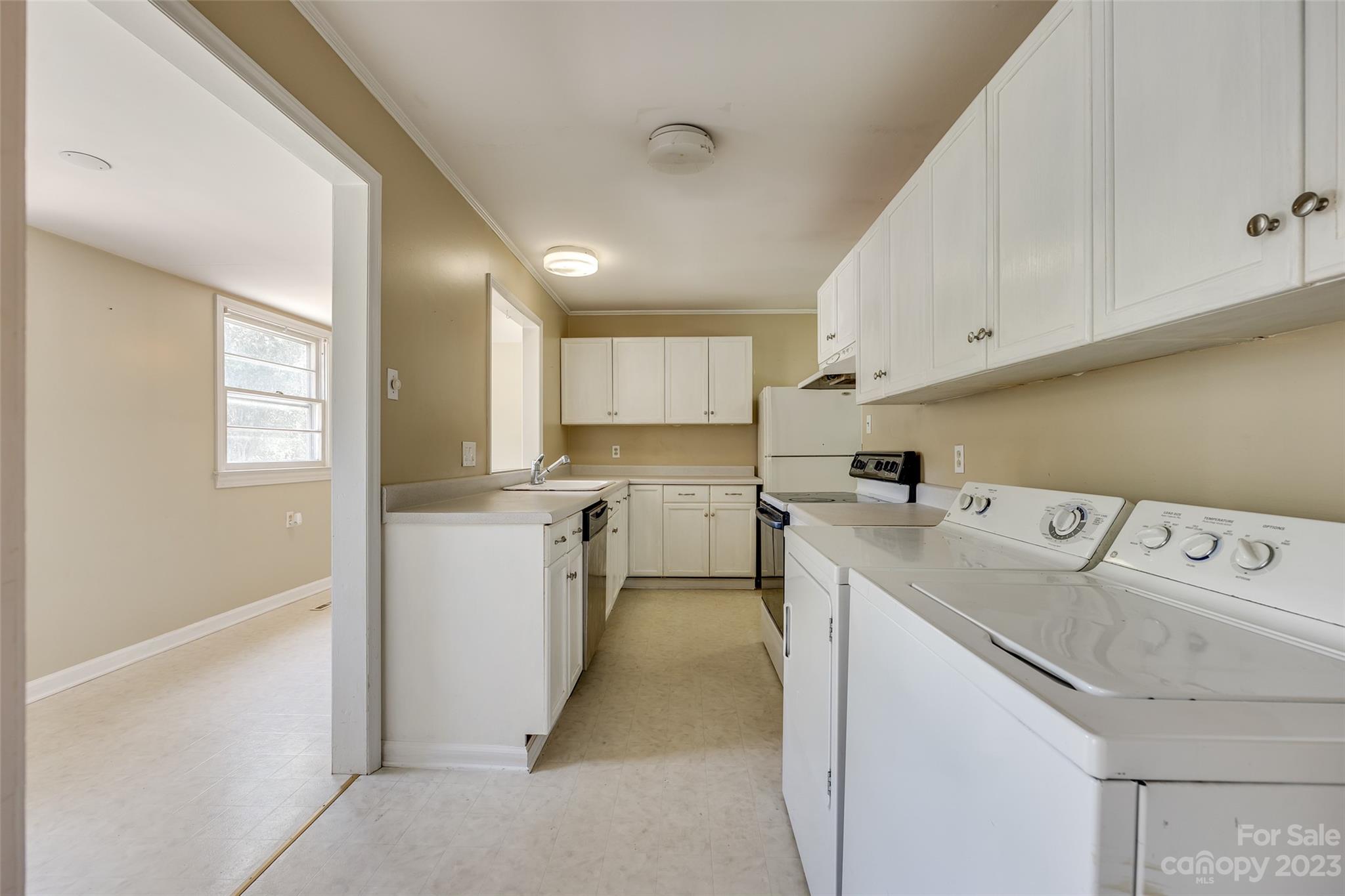1136 East Woodlawn Road Charlotte, NC 28209 - Photo 13 of 27 a view of a kitchen with sink and dishwasher