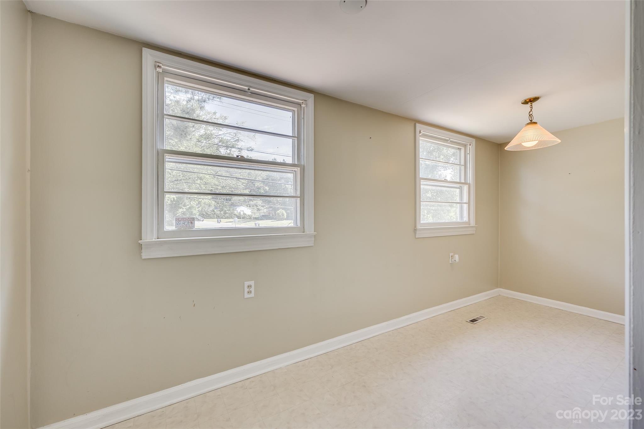 1136 East Woodlawn Road Charlotte, NC 28209 - Photo 14 of 27 an empty room with windows