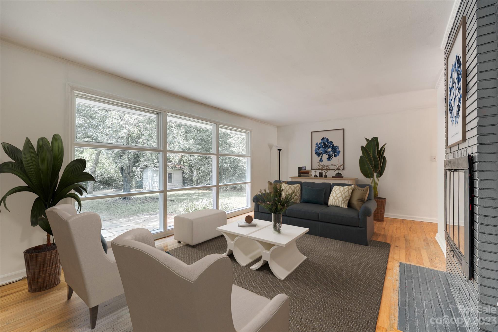 1136 East Woodlawn Road Charlotte, NC 28209 - Photo 18 of 27 a living room with furniture and a large window