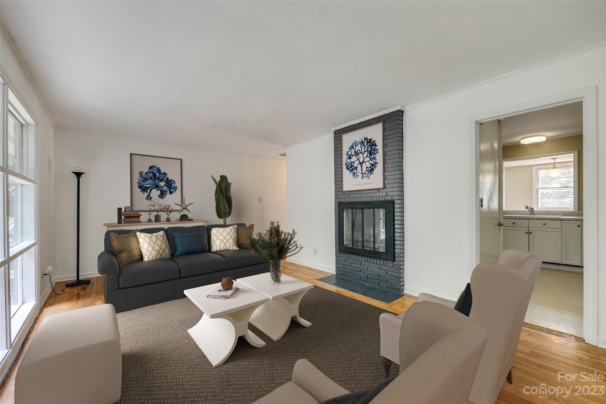 1136 East Woodlawn Road Charlotte, NC 28209 - Photo 19 of 27 a living room with furniture and a window