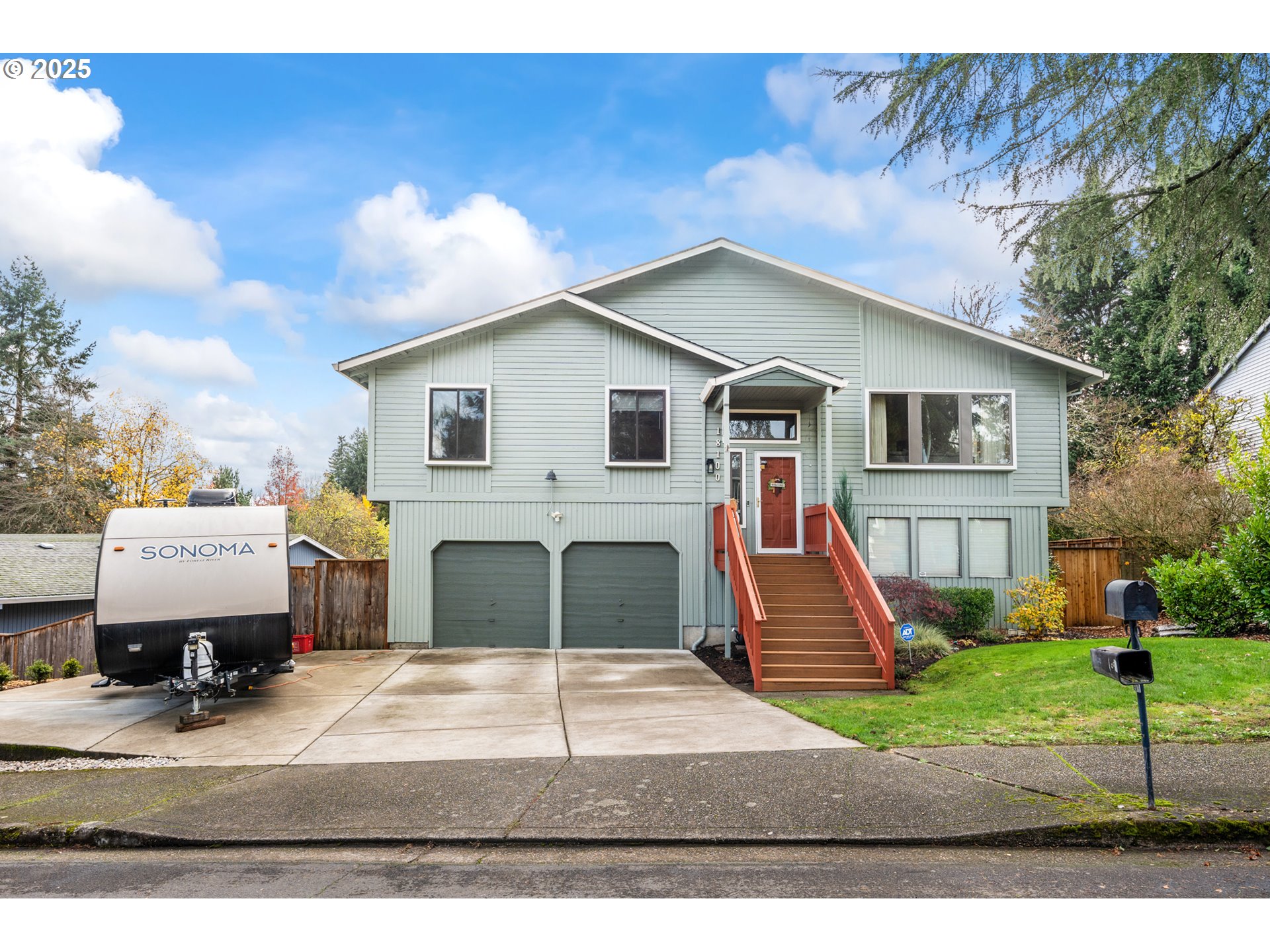 18100 Southwest Barcelona Way Beaverton, OR 97007 - Photo 2 of 41 a front view of a house with a yard