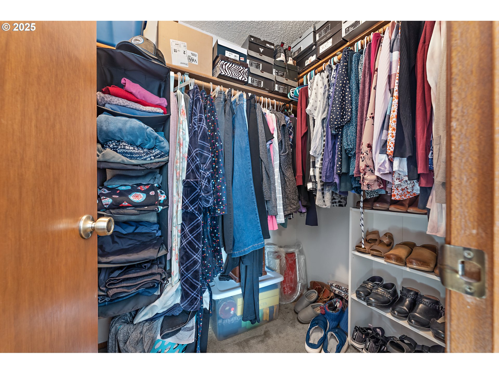 18100 Southwest Barcelona Way Beaverton, OR 97007 - Photo 21 of 41 a view of walk in closet with clothes and shoes