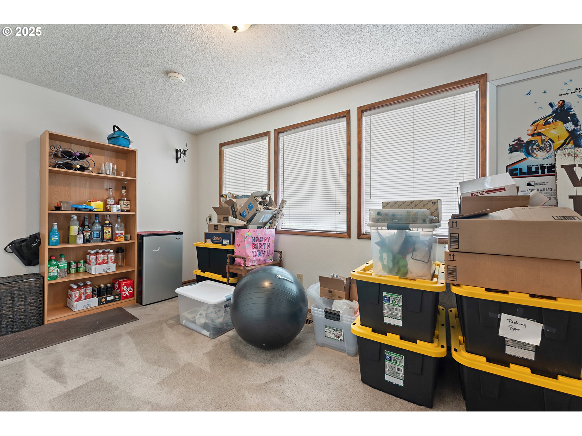 18100 Southwest Barcelona Way Beaverton, OR 97007 - Photo 26 of 41 a living room filled with furniture and a book shelf