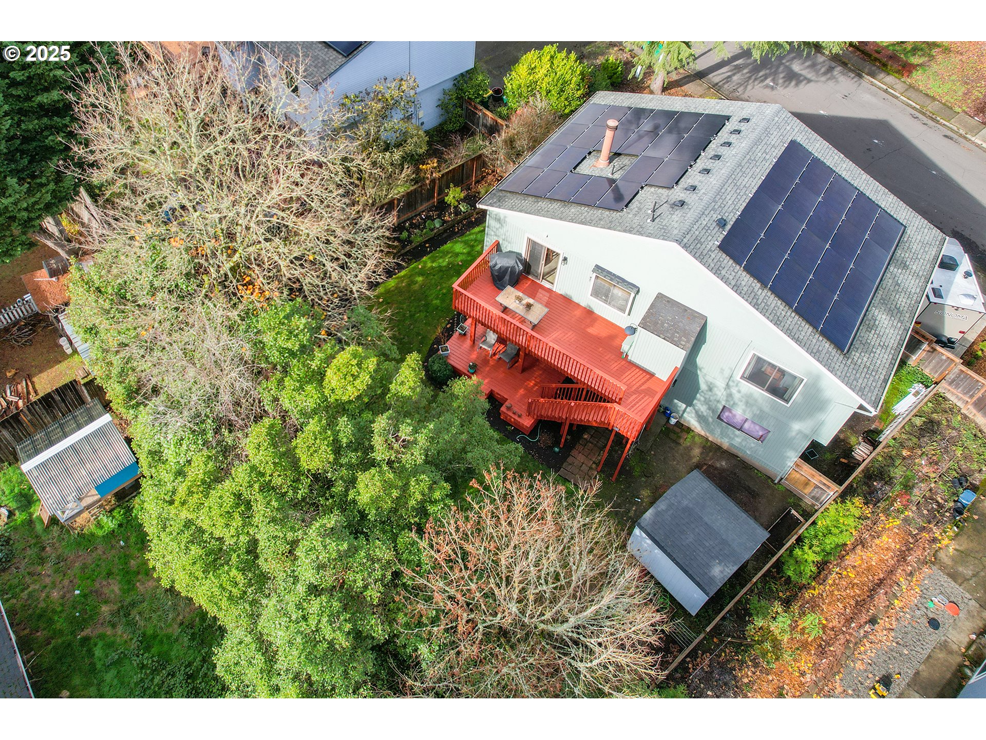 18100 Southwest Barcelona Way Beaverton, OR 97007 - Photo 39 of 41 an aerial view of a house with a yard and lake view