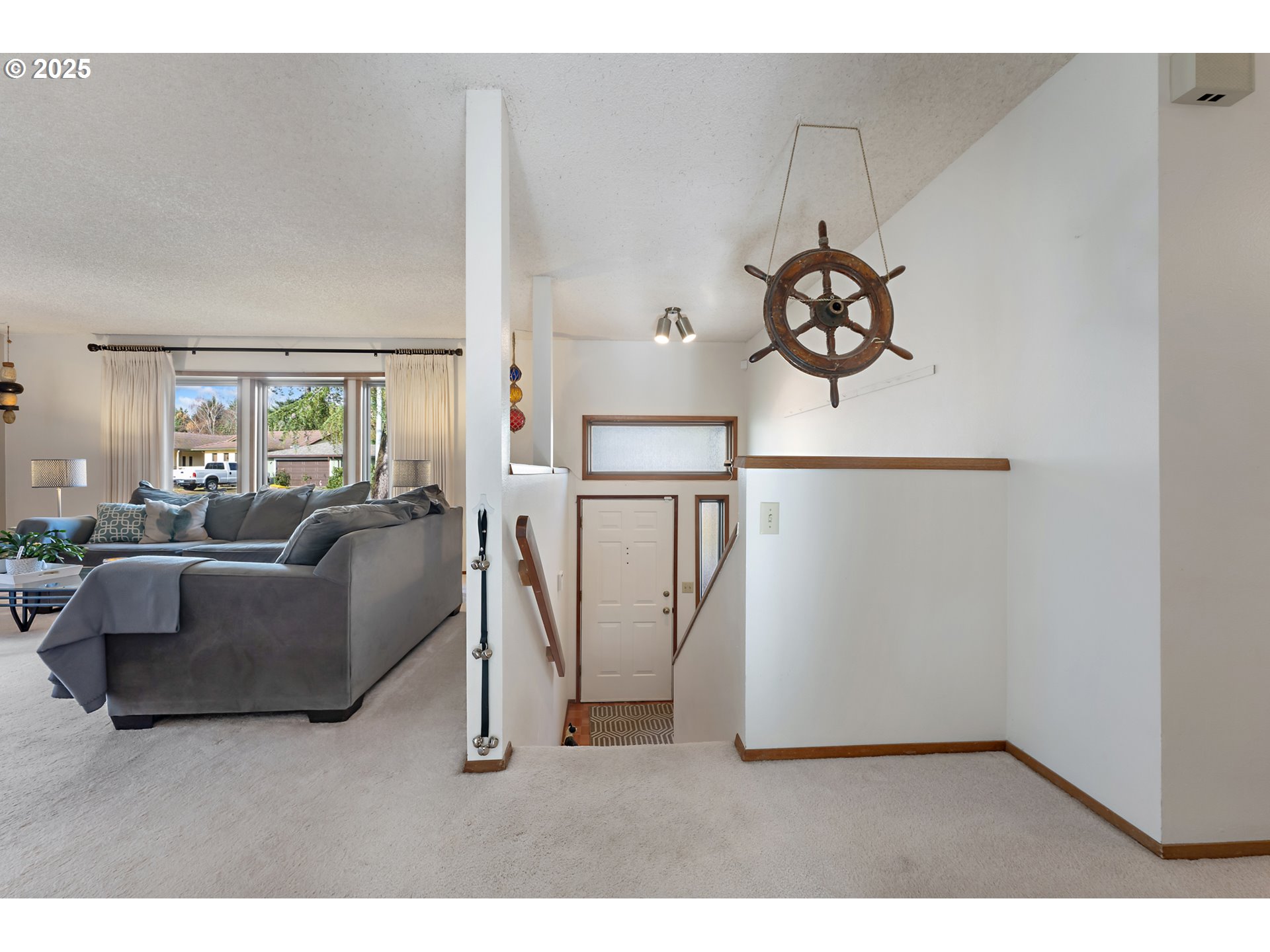 18100 Southwest Barcelona Way Beaverton, OR 97007 - Photo 4 of 41 a living room with furniture a refrigerator and a window