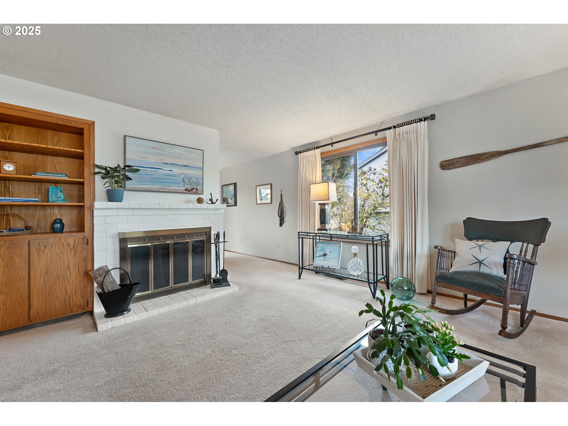 18100 Southwest Barcelona Way Beaverton, OR 97007 - Photo 7 of 41 a living room with furniture and a fireplace