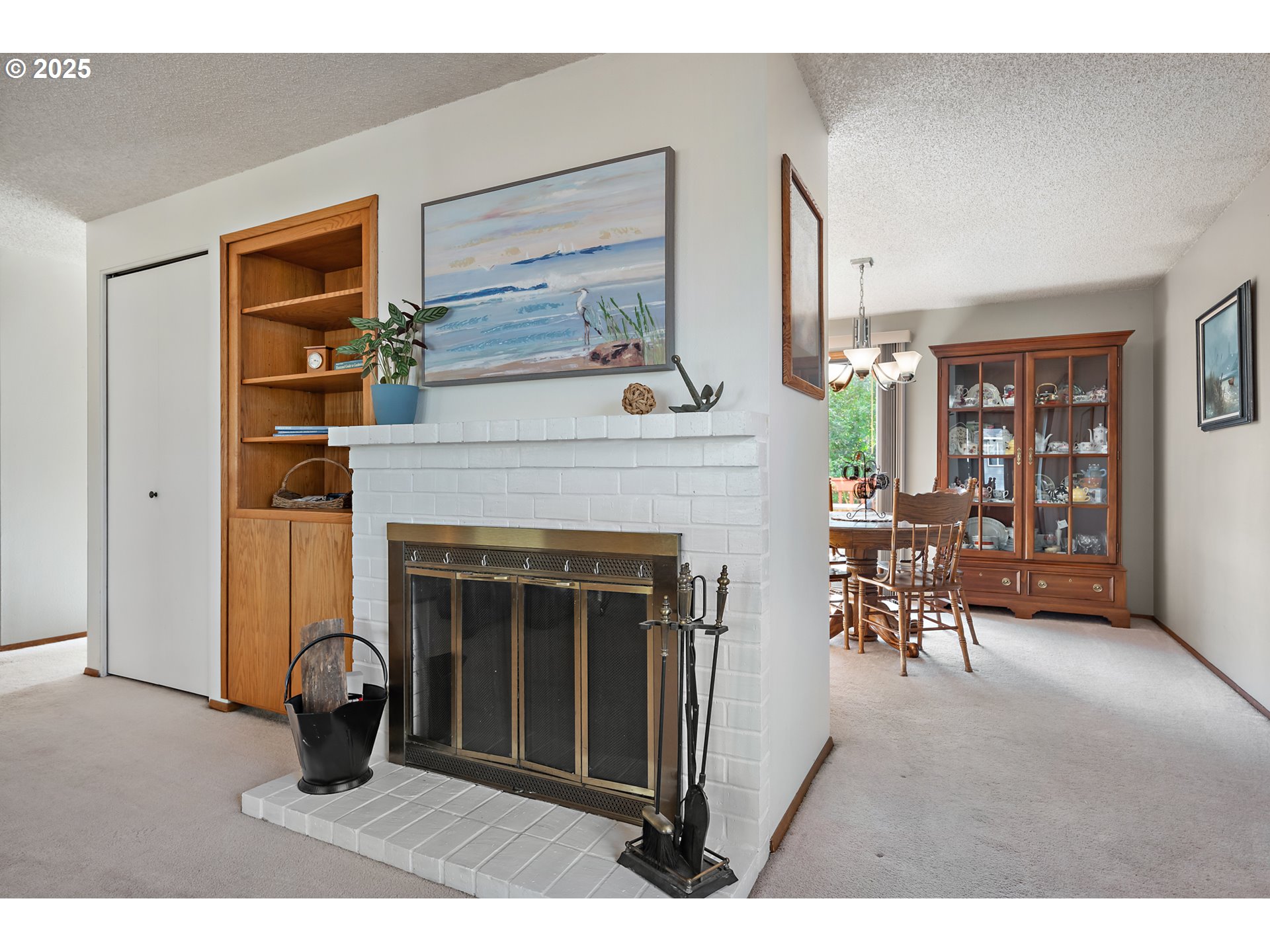 18100 Southwest Barcelona Way Beaverton, OR 97007 - Photo 8 of 41 a living room with furniture and a fireplace
