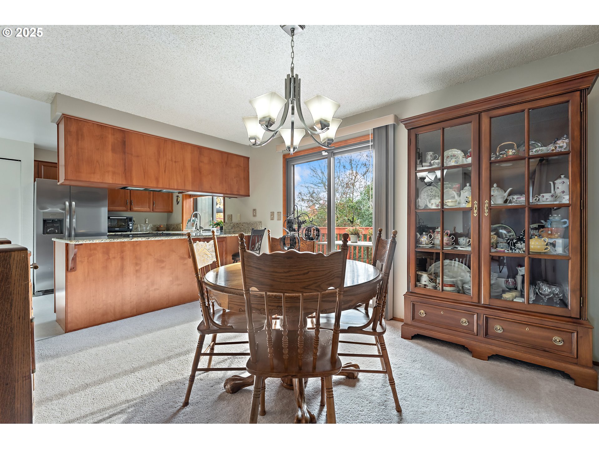 18100 Southwest Barcelona Way Beaverton, OR 97007 - Photo 9 of 41 a dining room with furniture a chandelier and window