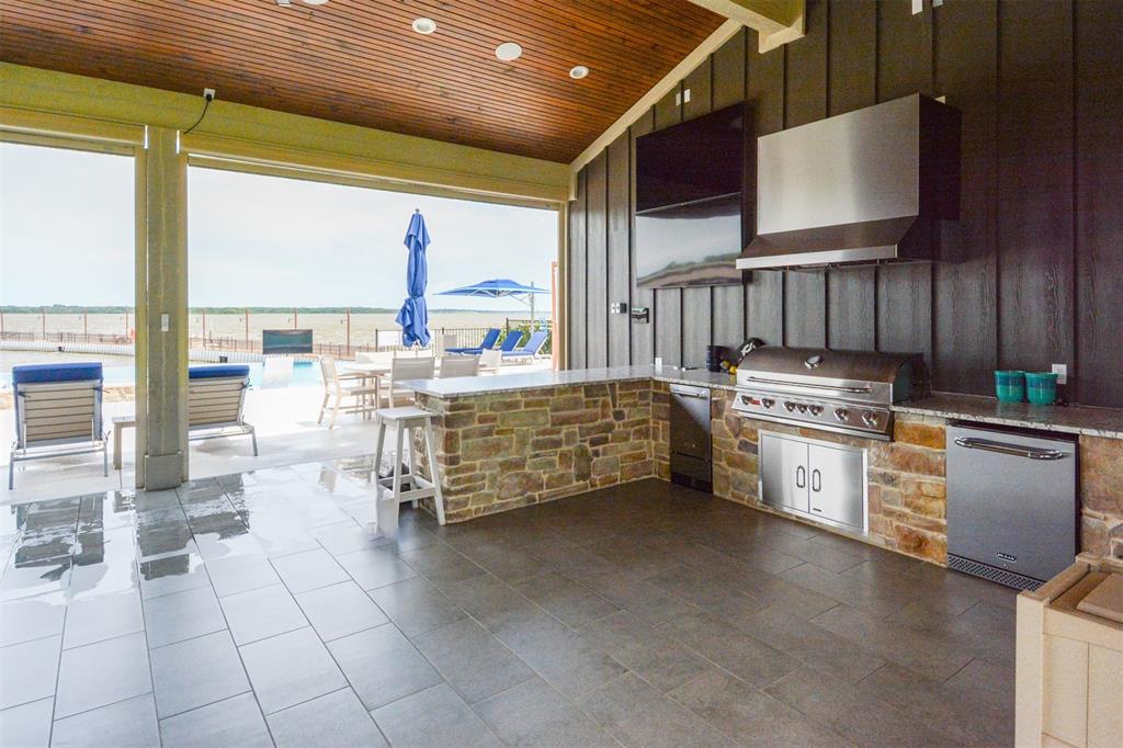 1183 Beacon Shr Road Kemp, TX 75143 - Photo 13 of 16 a kitchen with stainless steel appliances a stove a sink and white cabinets