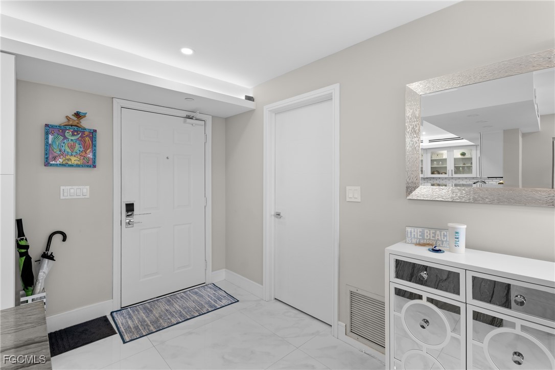 17 Bluebill Avenue, Unit 903 Naples, FL 34108 - Photo 22 of 33 a view of a bedroom with a hardwood