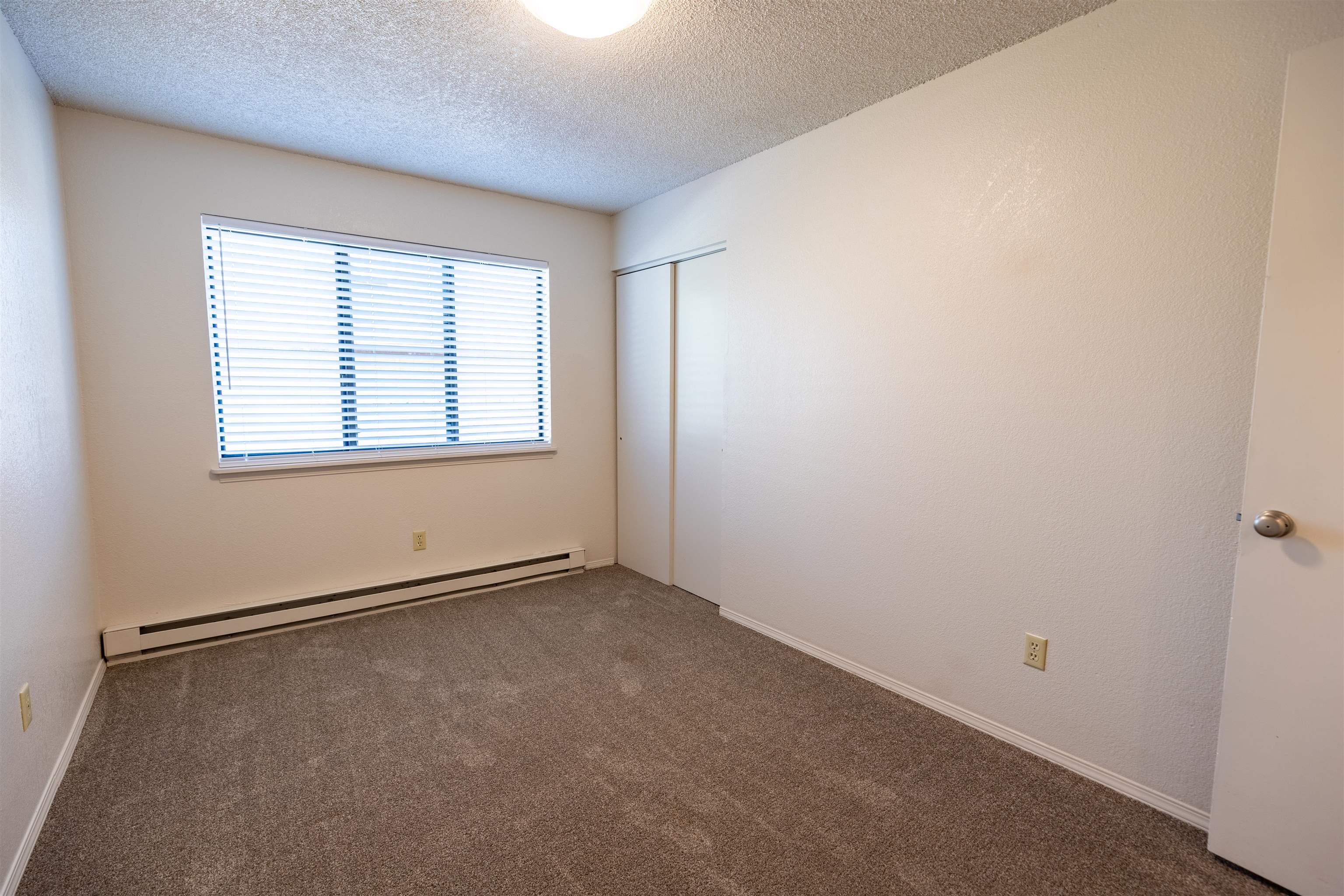 239 South Elm Street, Unit A Fruita, CO 81521 - Photo 12 of 22 an empty room with a window