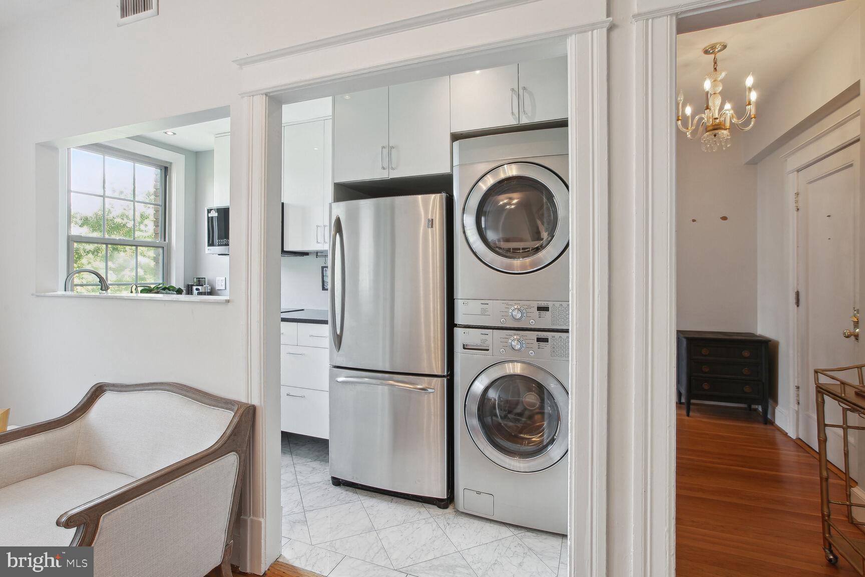 18 9th Street Northeast, Unit 401 Washington, DC 20002 - Photo 11 of 16 a utility room with sink dryer and washer