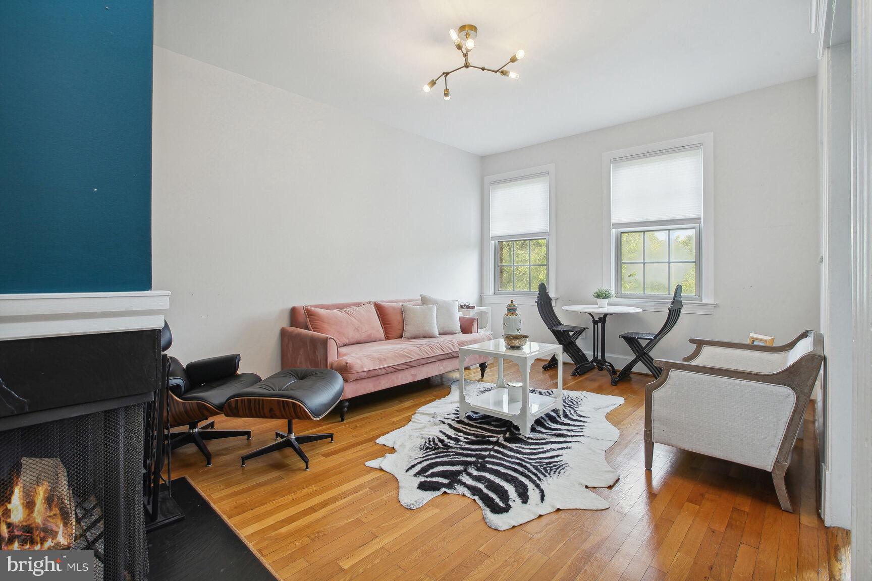 18 9th Street Northeast, Unit 401 Washington, DC 20002 - Photo 7 of 16 a living room with furniture and a window