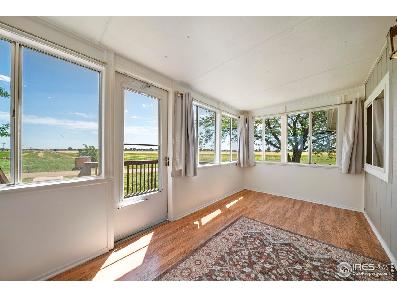 15260 County Road South Fort Morgan, CO 80701 - Photo 9 of 39 Sunroom, Patio, front porch~