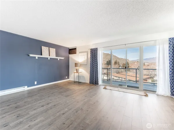 a bathroom with a granite countertop sink mirror vanity and toilet