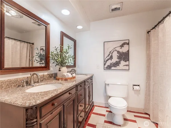a view of a room with wooden floor and cabinet