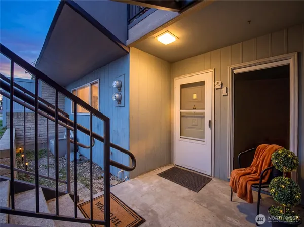 a kitchen with stainless steel appliances a refrigerator sink and microwave