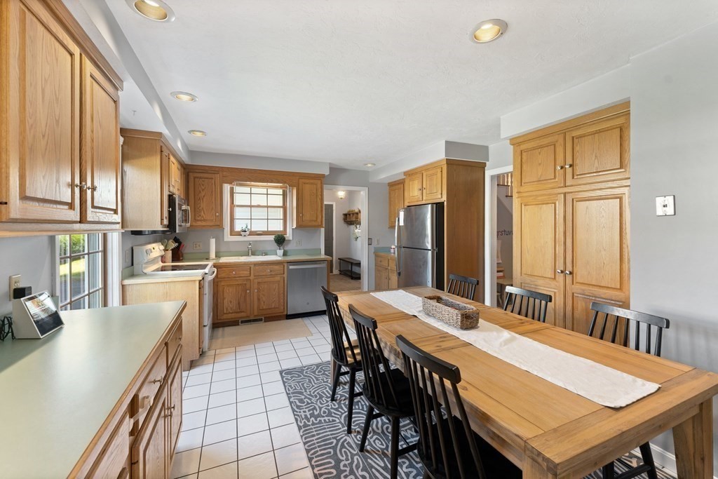 9 Bailin Drive Worcester, MA 01604 - Photo 11 of 30 a large kitchen with a table and chairs