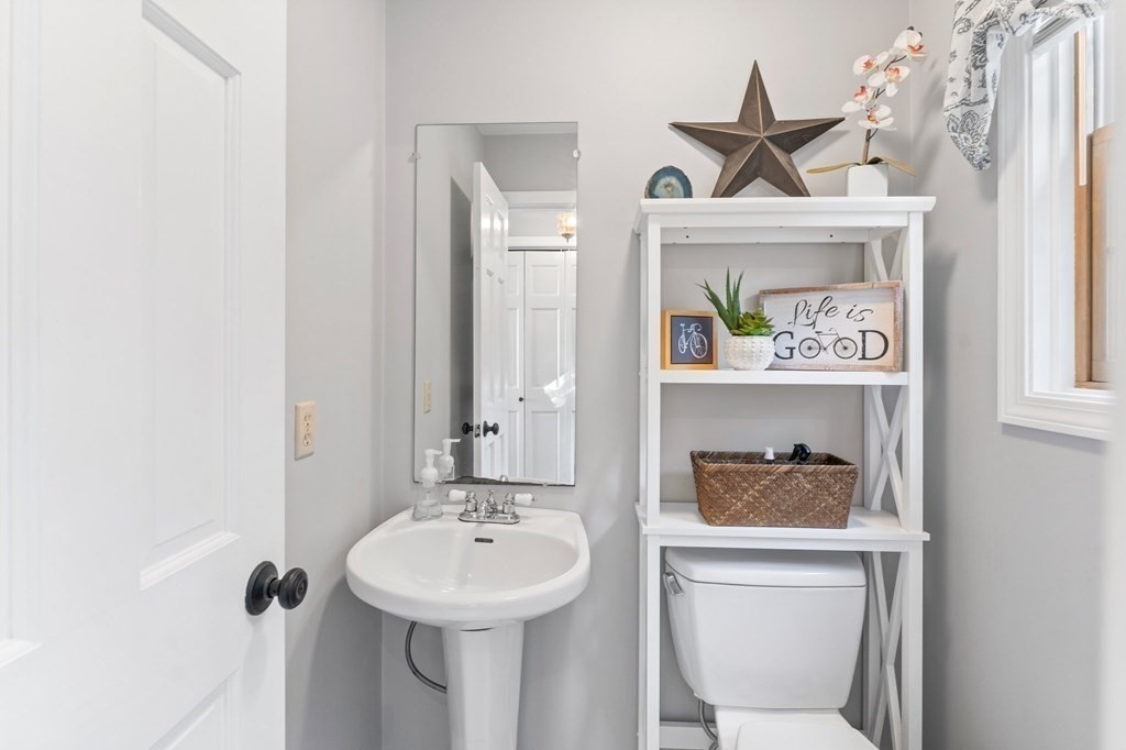 9 Bailin Drive Worcester, MA 01604 - Photo 18 of 30 a bathroom with a sink a mirror and a toilet
