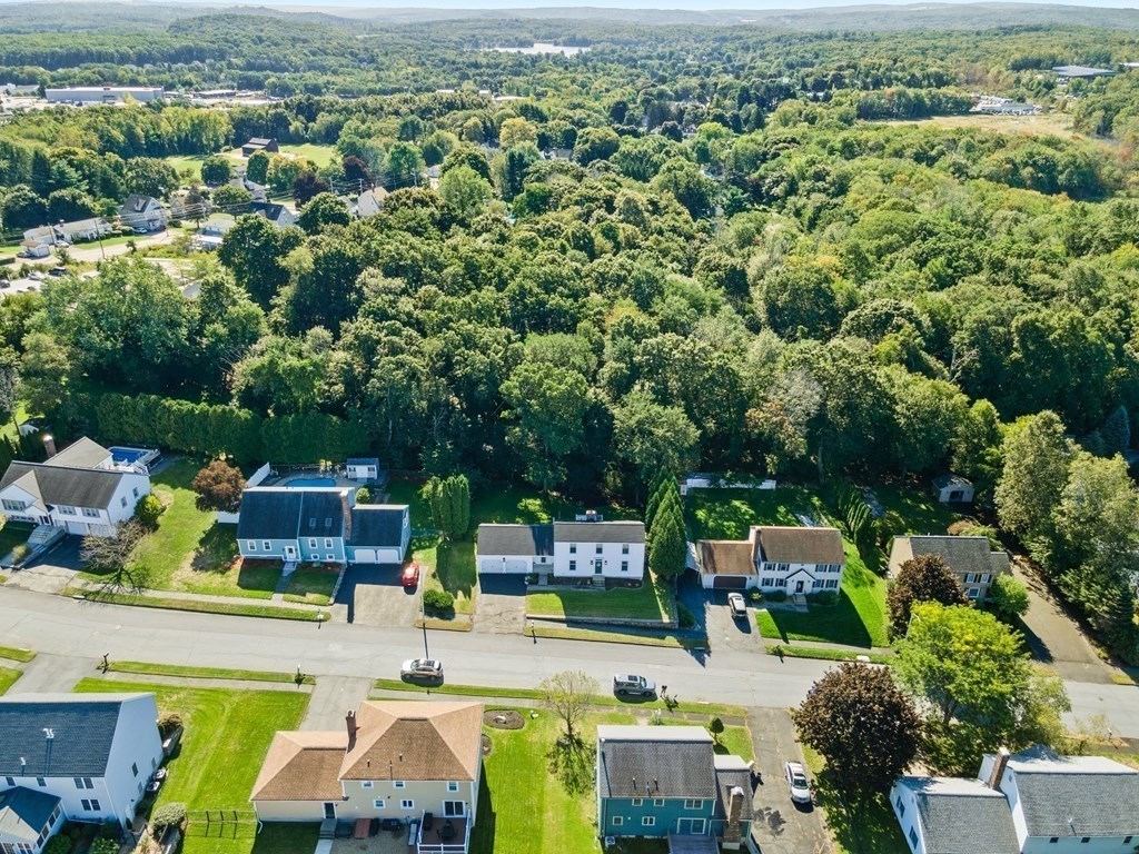 9 Bailin Drive Worcester, MA 01604 - Photo 7 of 30 an aerial view of a swimming pool with lawn chairs and plants