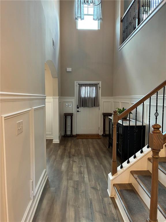 161 Donovan Avenue Locust Grove, GA 30248 - Photo 15 of 42 a view of a hallway with wooden floor and staircase