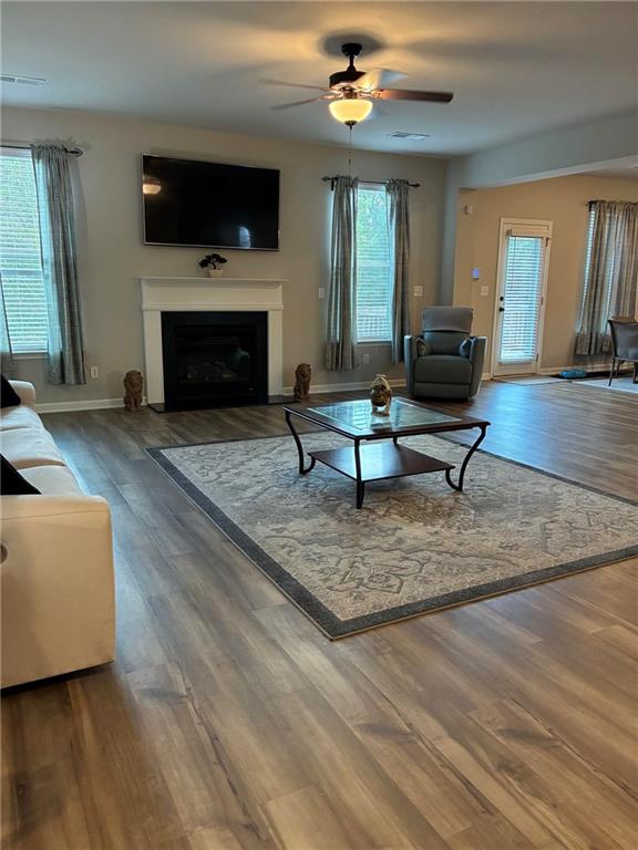 161 Donovan Avenue Locust Grove, GA 30248 - Photo 16 of 42 a living room with furniture a flat screen tv and a fireplace