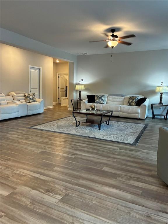 161 Donovan Avenue Locust Grove, GA 30248 - Photo 18 of 42 a living room with furniture and a lamp