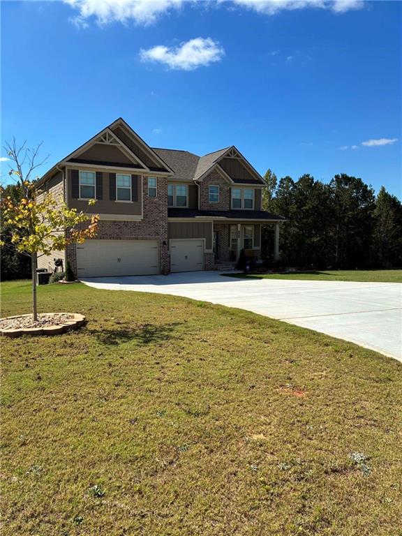 161 Donovan Avenue Locust Grove, GA 30248 - Photo 2 of 42 a front view of a house with a yard