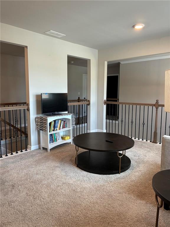 161 Donovan Avenue Locust Grove, GA 30248 - Photo 24 of 42 a living room with furniture and a flat screen tv
