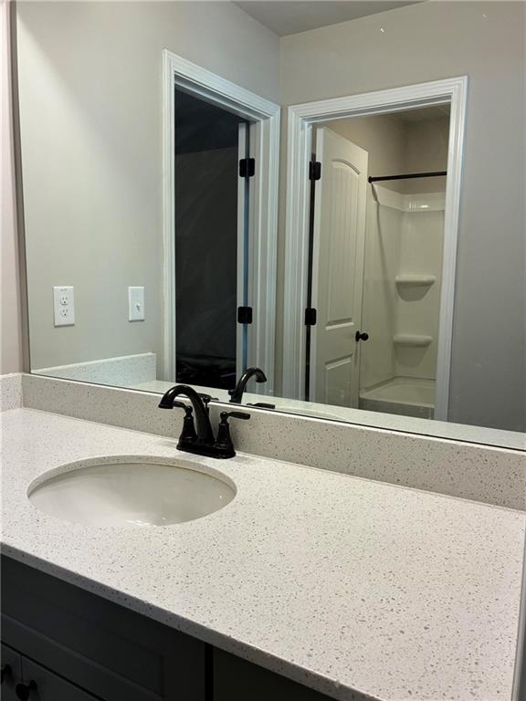 161 Donovan Avenue Locust Grove, GA 30248 - Photo 35 of 42 a bathroom with a sink and a mirror